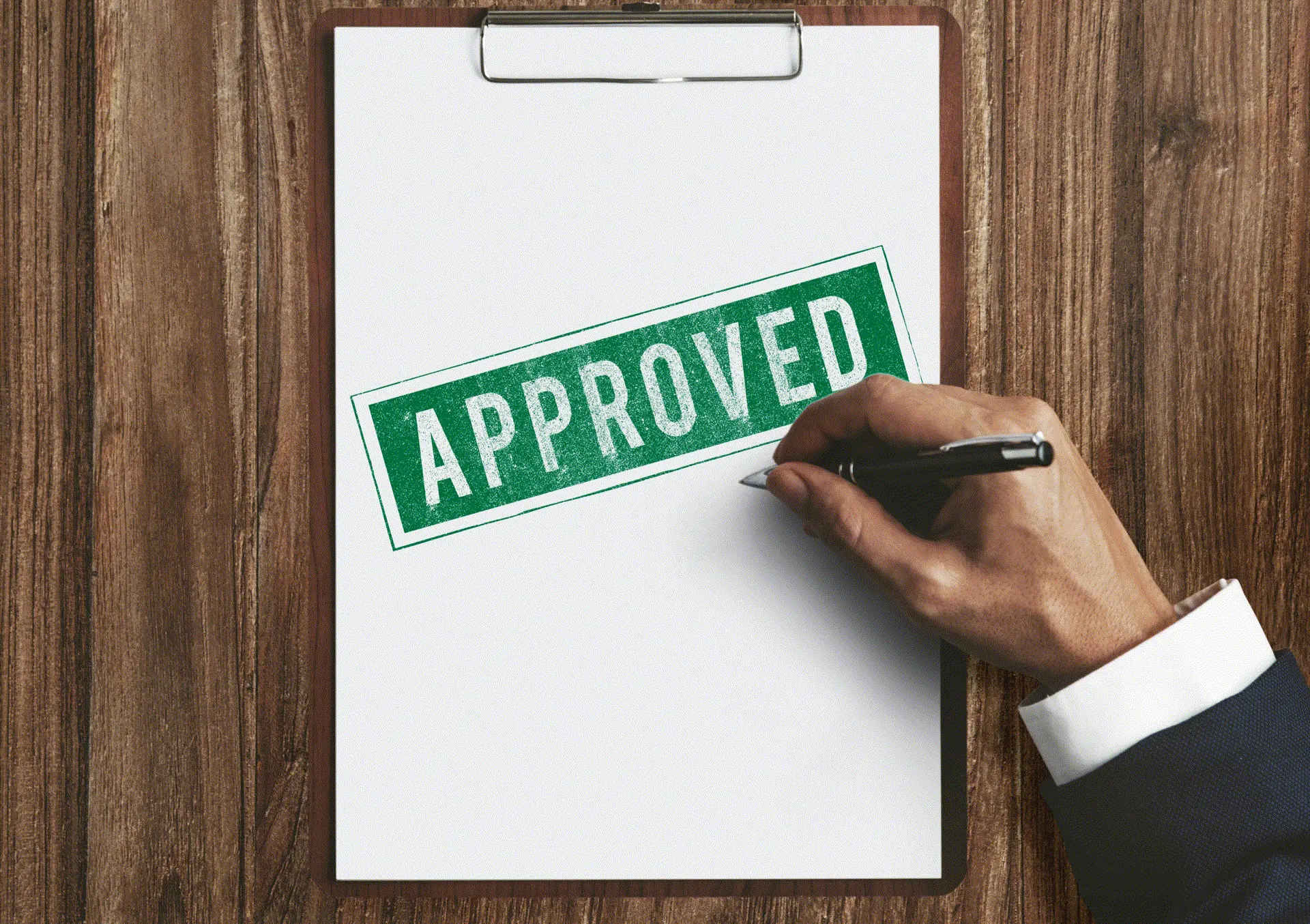 Council approval stamp on a document, engineer signing off